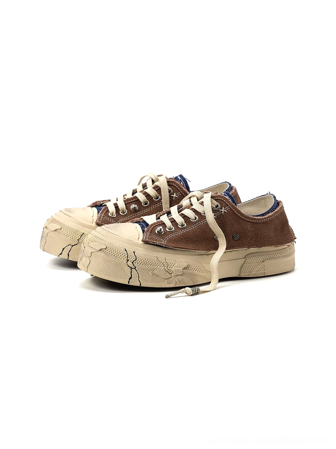 Pair of brown distressed platform sneakers shown from above with off-white laces and vintage streetwear styling