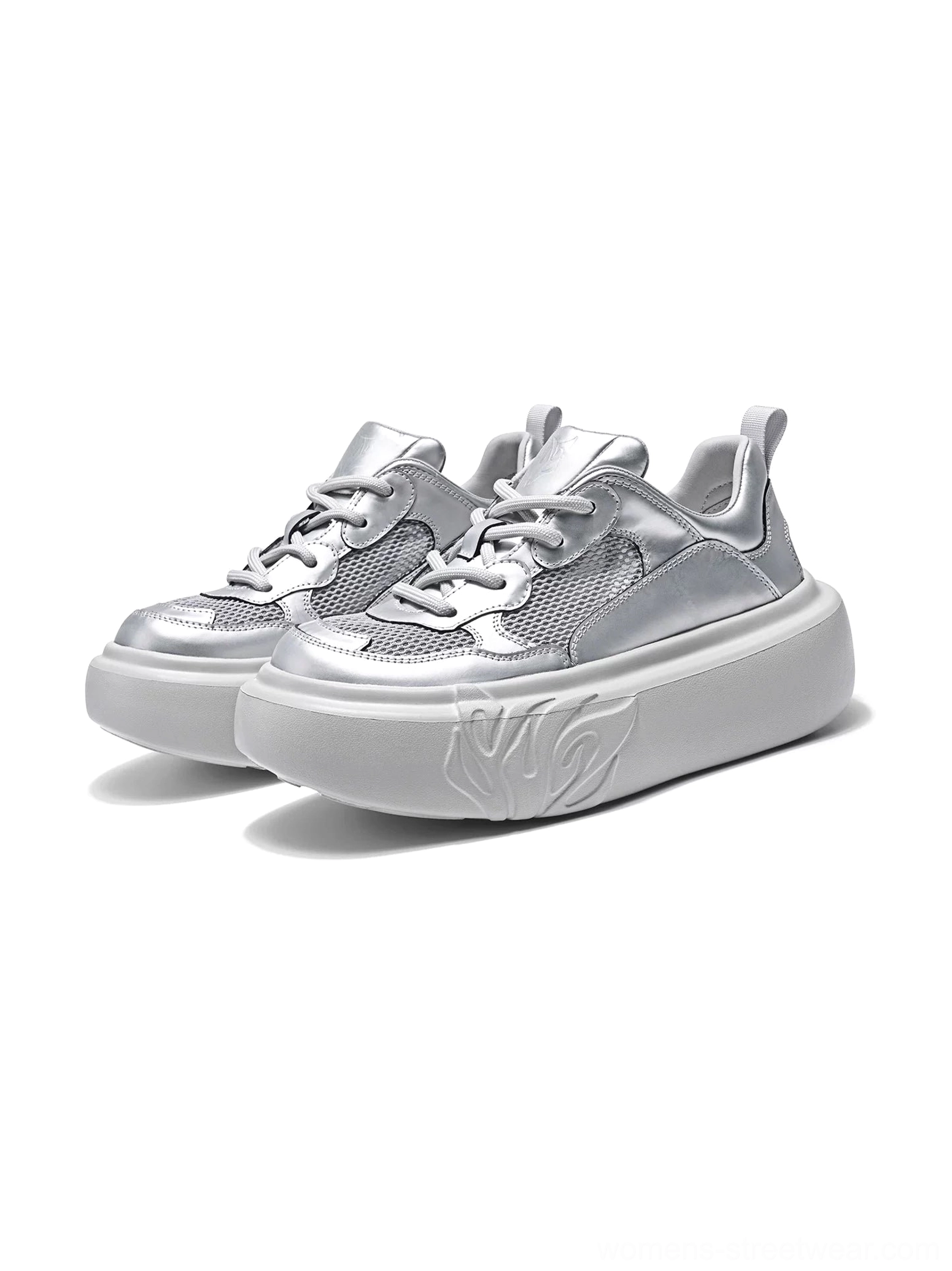Pair of metallic silver platform sneakers with lace-up closure, breathable mesh upper, rounded chunky outsole, and flame embossed sidewall