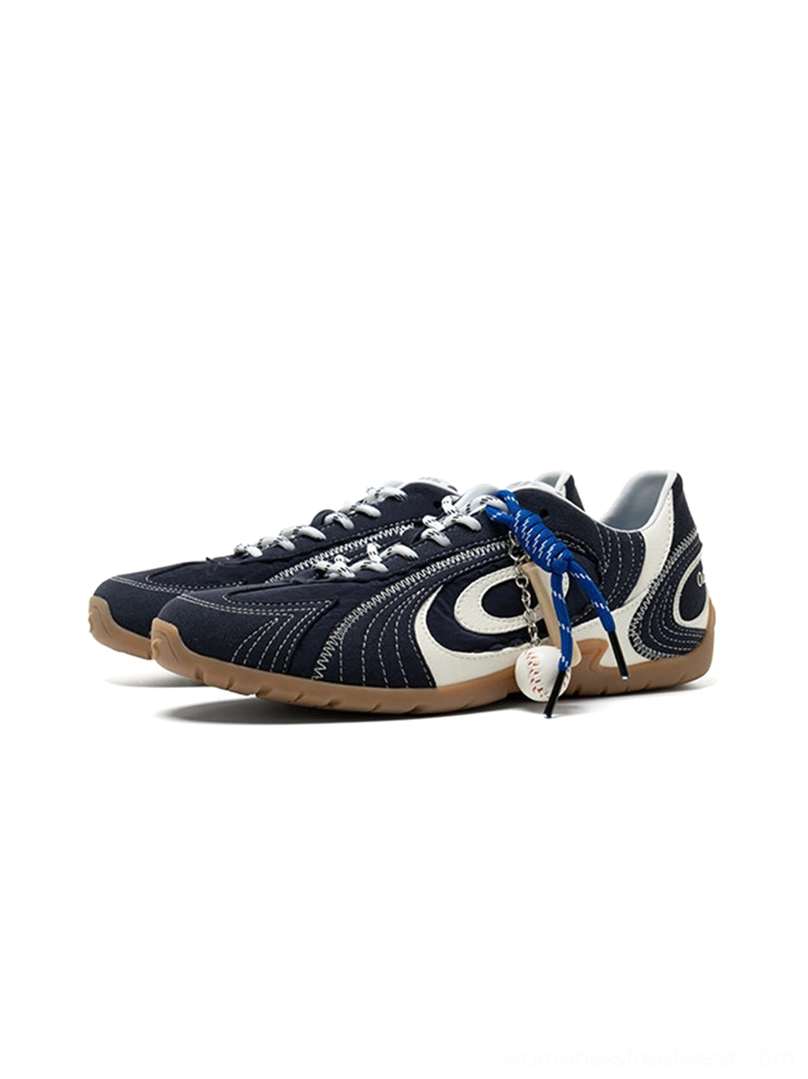 Pair of navy swirl-panel low-profile trainers displayed from the front with blue laces and brown gum outsoles