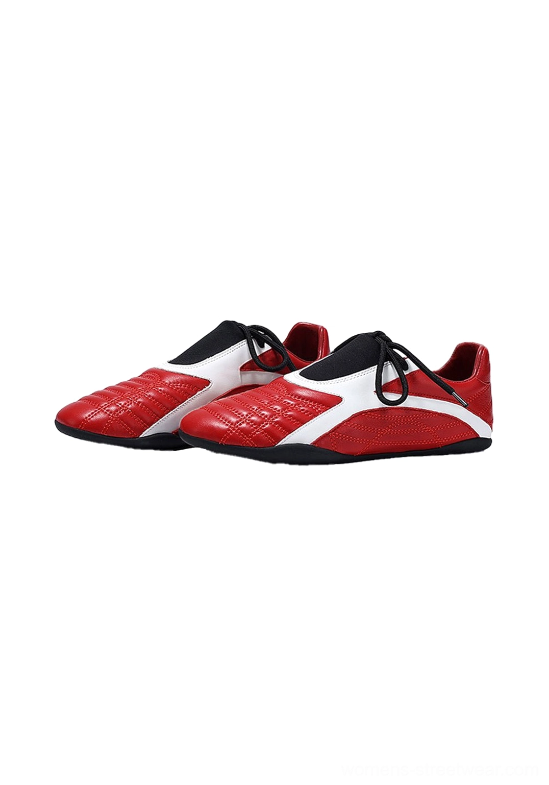 Pair of red quilted panel flat sole sneakers displayed in a three-quarter front view with white accents and black laces