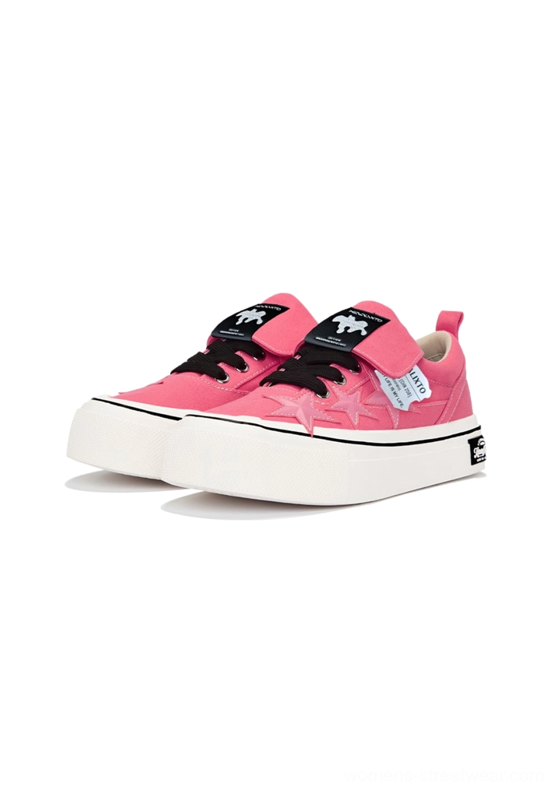Pair of rose pink canvas platform sneakers with black laces side star panels fold-over straps and thick white soles
