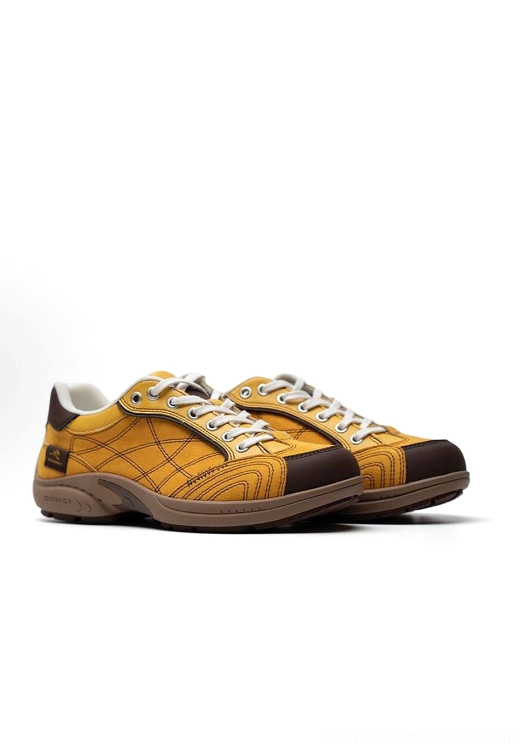 Side-by-side front profile product display of paired vintage colorblock German trainer sneakers on white background showing colorblock and grid texture design
