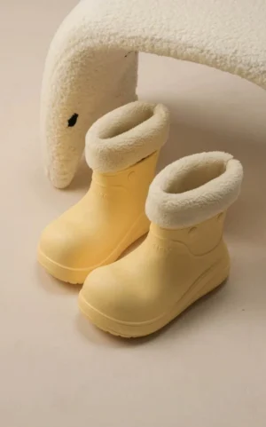 Pale yellow puff cloud platform boots with rolled faux fur lining and rounded EVA sole in top view