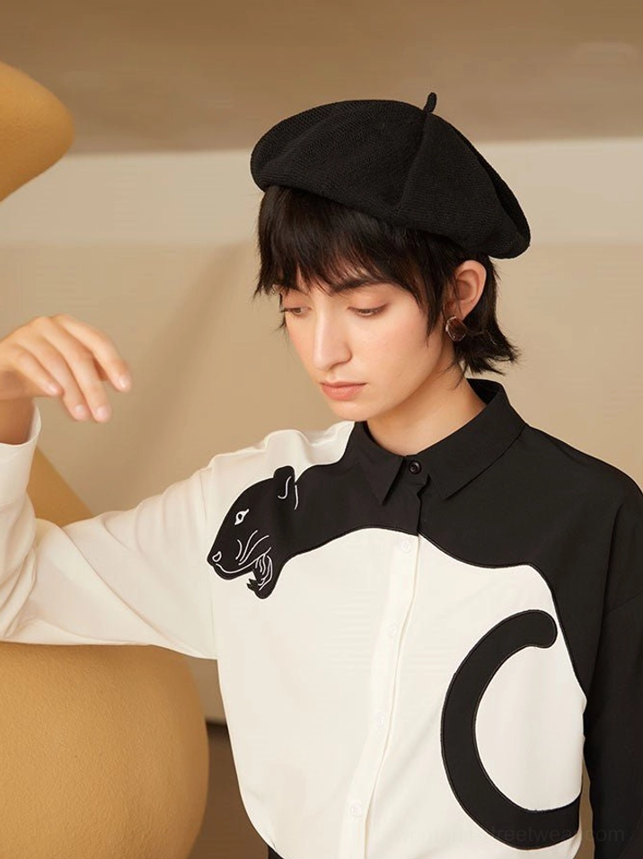 Panther blouse product image highlighting its structured button front and expressive embroidered detail