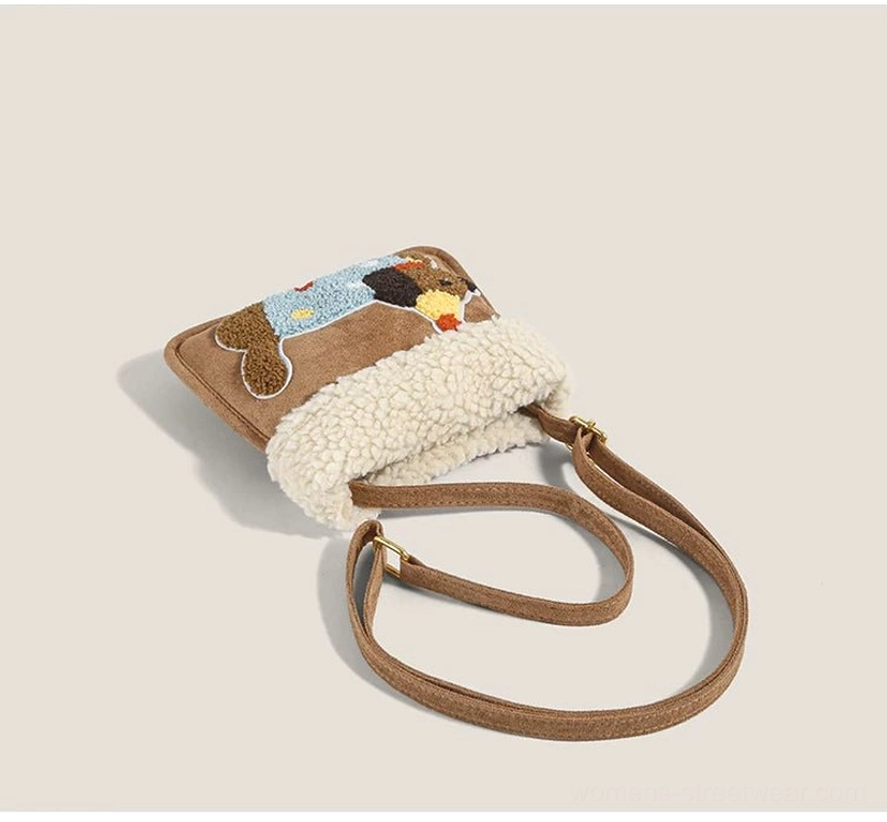 Party pup sherpa faux suede mini crossbody bag angled flat lay showing side profile puppy embroidery and shoulder strap