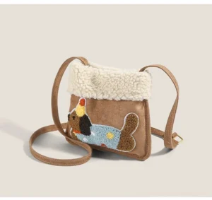 Party pup sherpa faux suede mini crossbody bag side three-quarter view showing adjustable strap and gold-tone buckle hardware