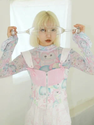 Close-up of a pastel bunny print corset top layered over a sheer high-neck mesh long sleeve shirt with pink quilted front