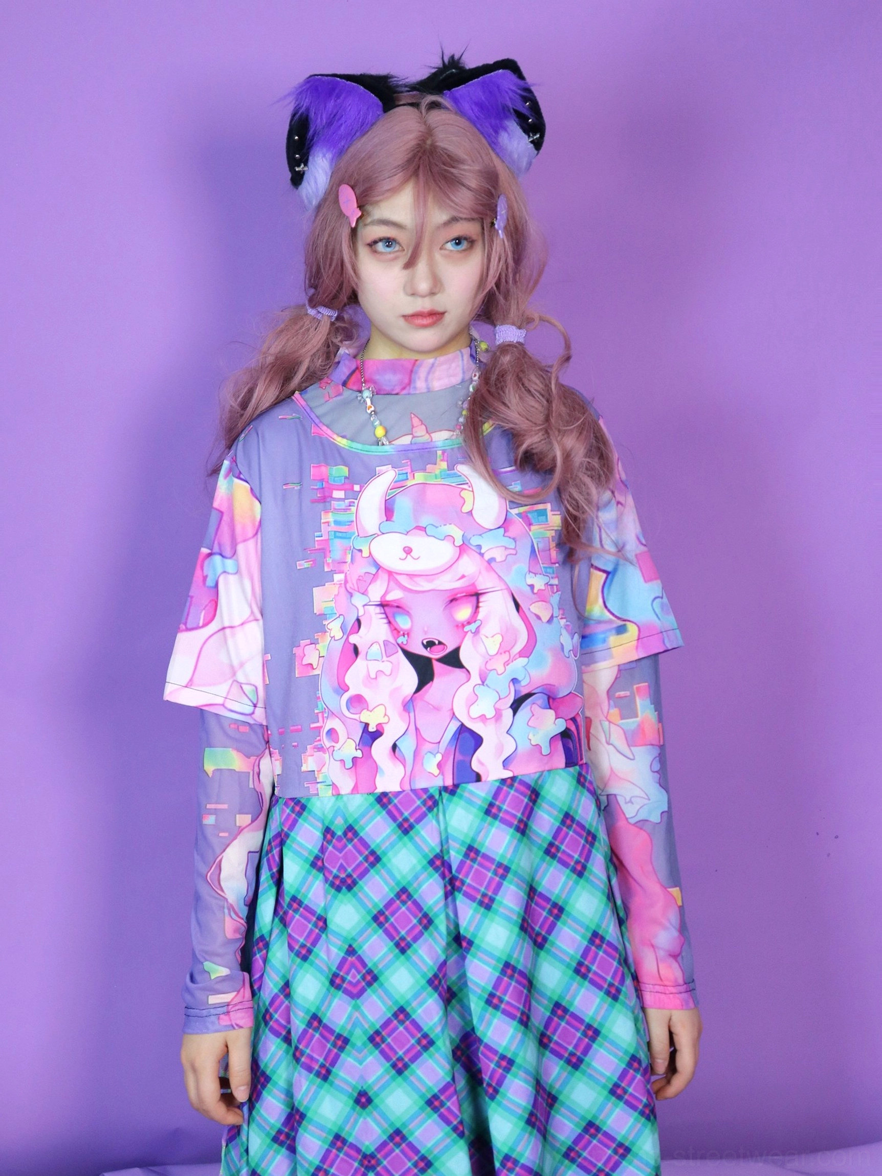 Pastel cartoon mesh long sleeve top layered under a graphic short sleeve shirt with a pastel plaid midi skirt