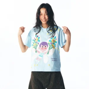 Sky blue pastel fairy graphic cotton streetwear tee worn by female model in front studio view