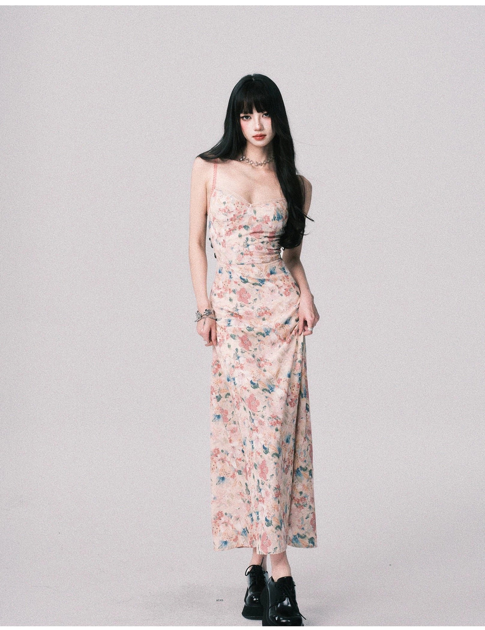 Pastel floral maxi slip dress with ruched neckline, fitted waist, full length flowing skirt, chunky black loafers, and delicate jewelry