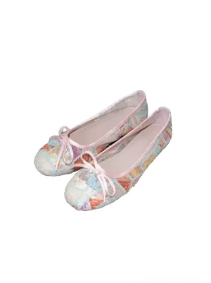 Pastel floral mesh bow ballet flats in multicolor print with pink trim and rounded toe on a white background