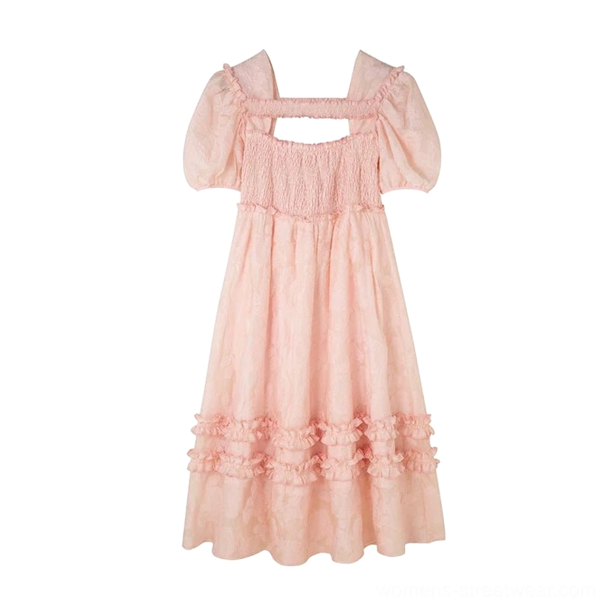Flat lay view of a pastel pink Korean style square-neck midi dress with shirred bust panel, puff sleeves, and layered ruffle hem