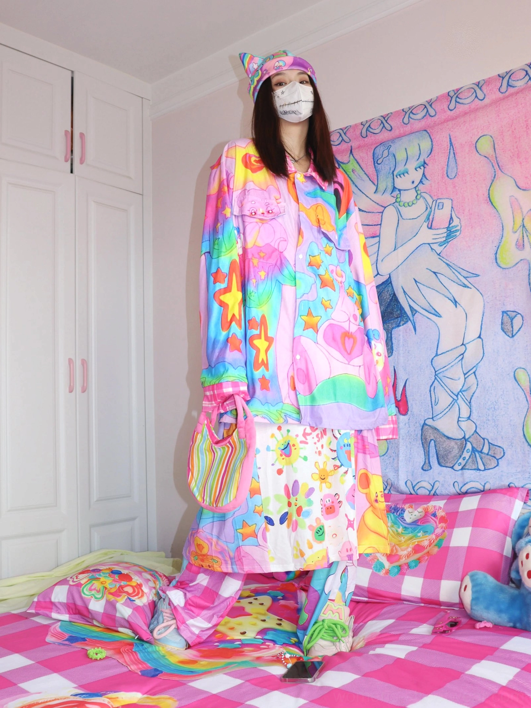 Pastel rainbow star print oversized corduroy streetwear shirt styled as a colorful Y2K Harajuku outfit with cartoon graffiti graphics and a crossbody bag