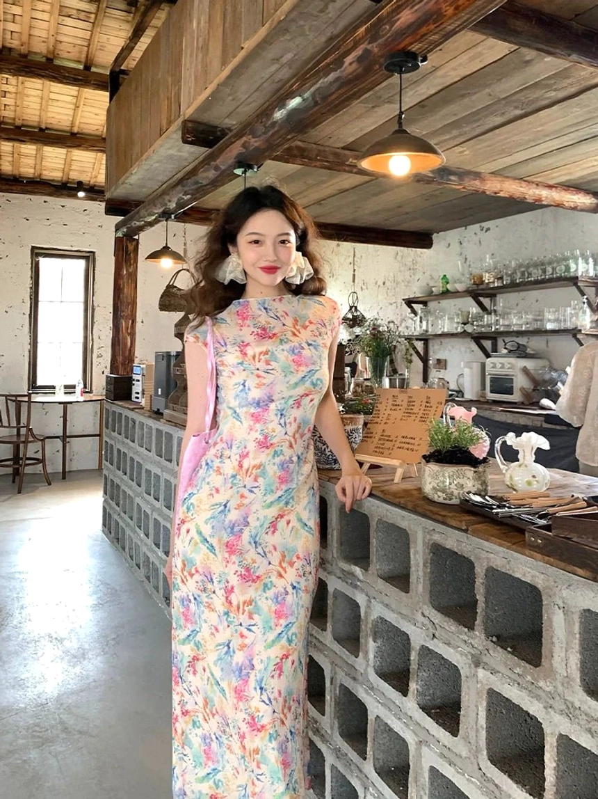 Full body view of pastel watercolor floral cheongsam-inspired maxi dress with high neck and slim long silhouette