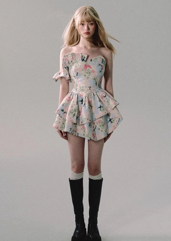 Pastel watercolor floral mini dress with romantic ruffle styling, fitted bodice, flared skirt, and contemporary Y2K feminine streetwear aesthetic