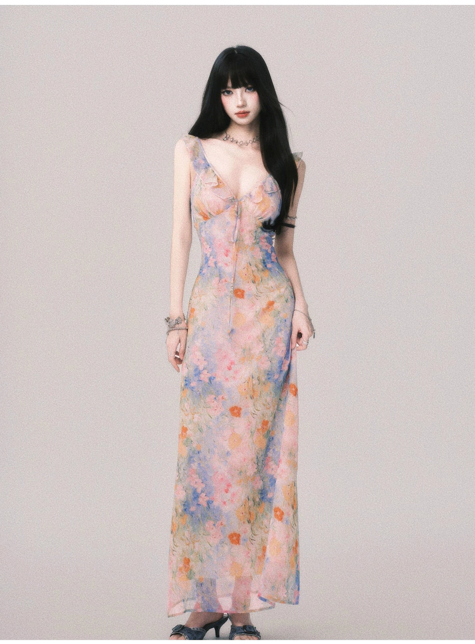 Pastel watercolor floral ruffle maxi slip dress for women shown in a full front studio view