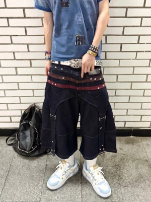 Unisex paw print court sneakers styled with a blue shirt and relaxed baggy denim in an outdoor streetwear outfit