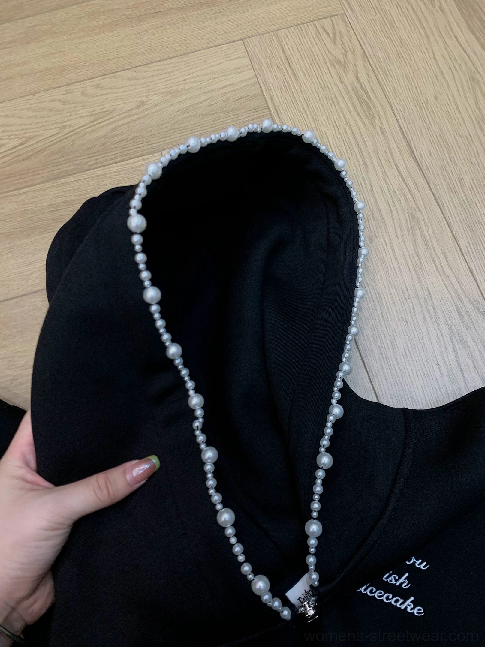 Black pearl trim oversized zip-up cloud hoodie close-up with faux pearl hood edge and chest embroidery