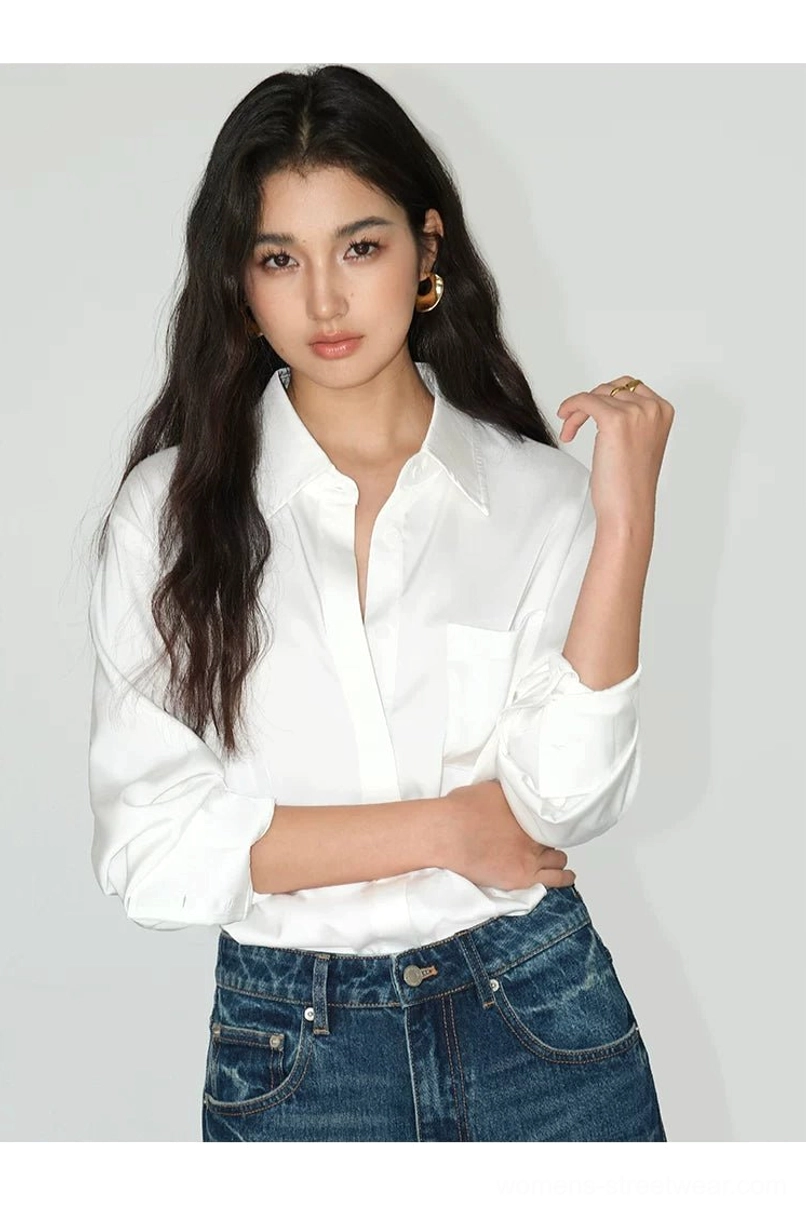 Pearl white satin pocket shirt with fluid drape and one rolled sleeve styled for casual Korean fashion
