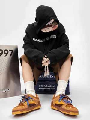 Perforated dual-lace platform sneakers worn with white socks, brown shorts, and a black hoodie in a Seoul-inspired streetwear outfit