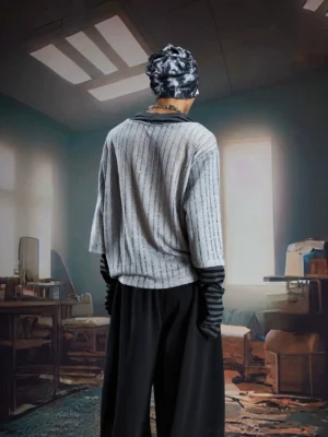 Back view of gray phantom stripe layered knit streetwear tee with black and gray striped long sleeve cuffs
