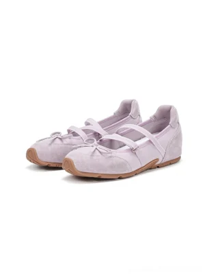 Pair of pastel pink lavender Mary Jane ballet sneakers viewed from above with bows crossover straps and gum soles