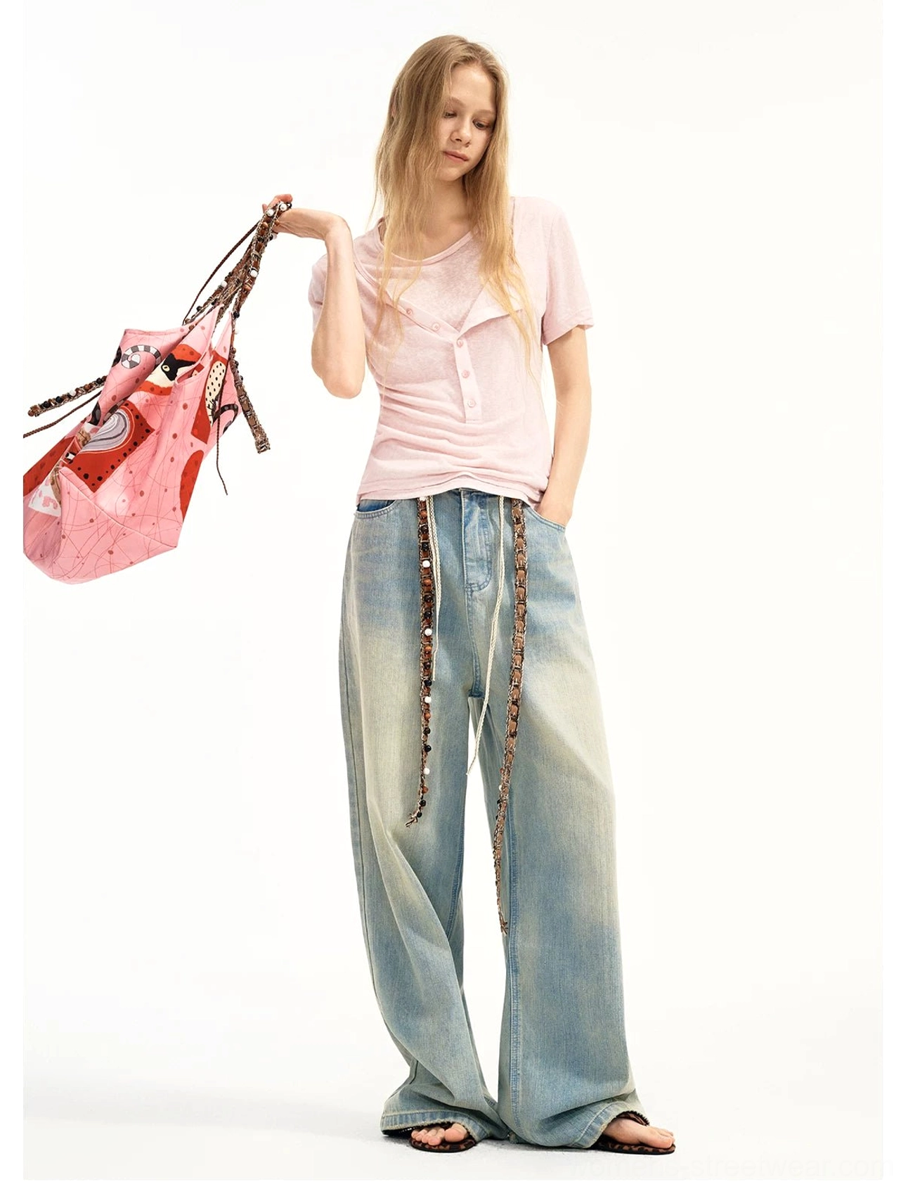 Pink candy hearts kitty patchwork tote worn with a basic pink tee and wide leg denim jeans in a casual everyday streetwear outfit