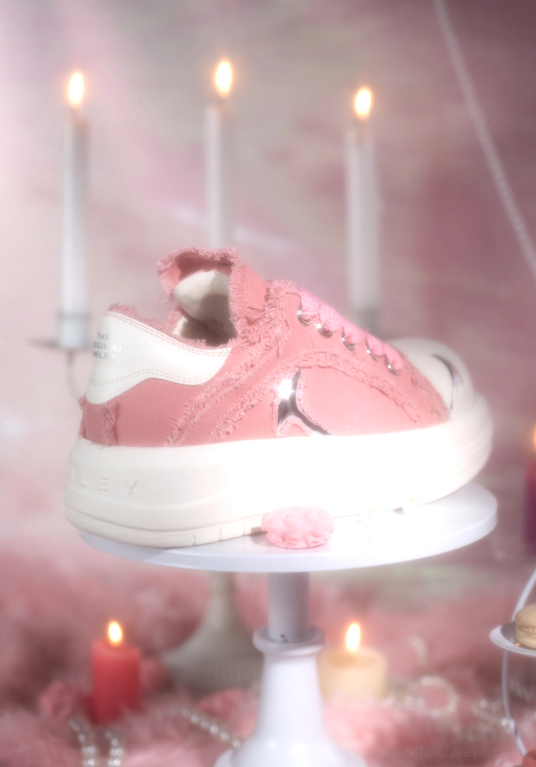 Rear side view of pink canvas platform skate sneaker with white heel counter, silver side accent, frayed fabric, and chunky rubber sole