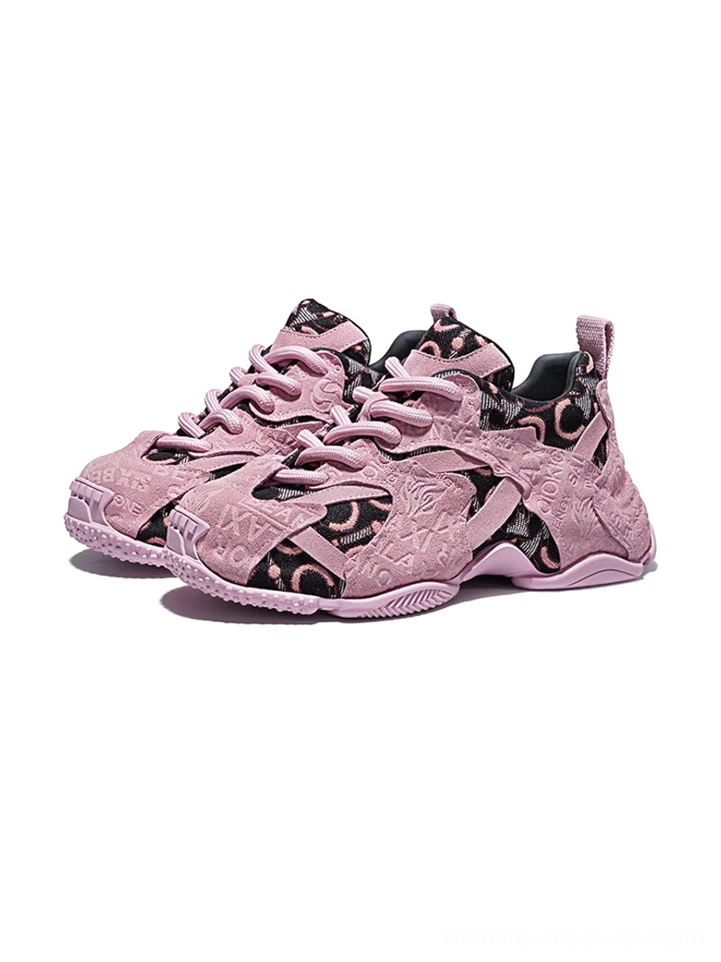 Pair of pink embroidered chunky dad sneakers displayed from the front with matching textured uppers, lace-up design and oversized athletic soles