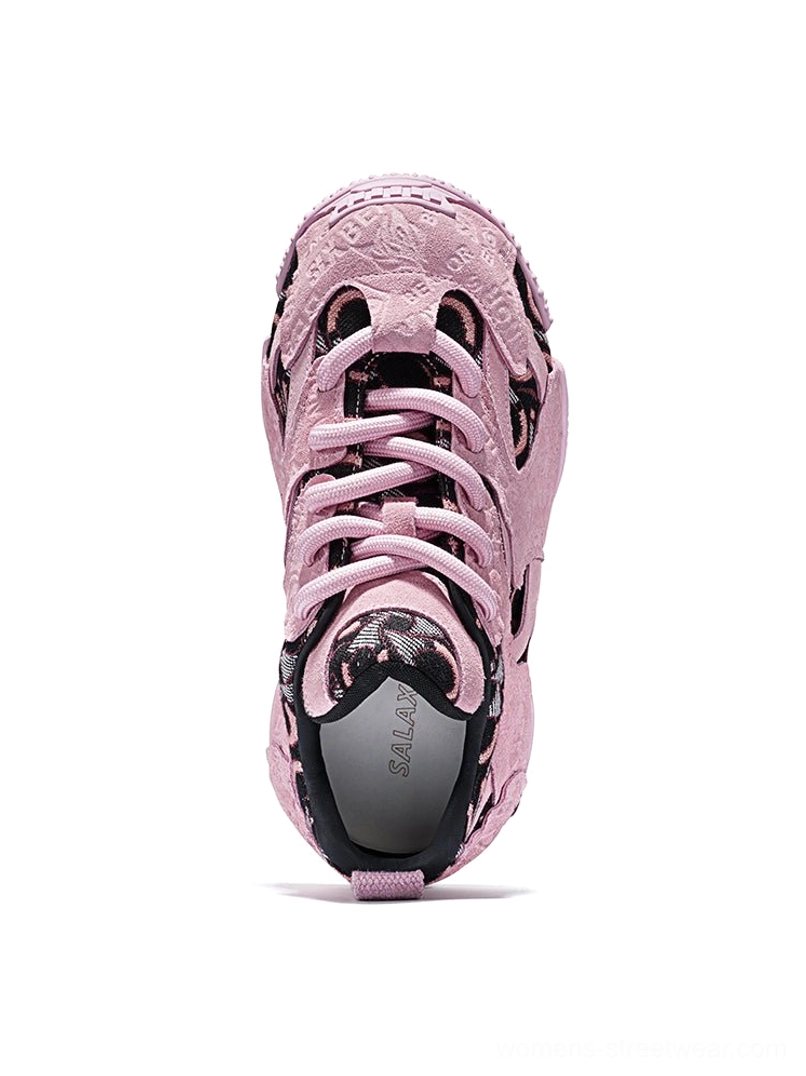 Top-down view of pink embroidered chunky dad sneakers showing the lace-up system, embossed toe cap, textured panels and cushioned opening