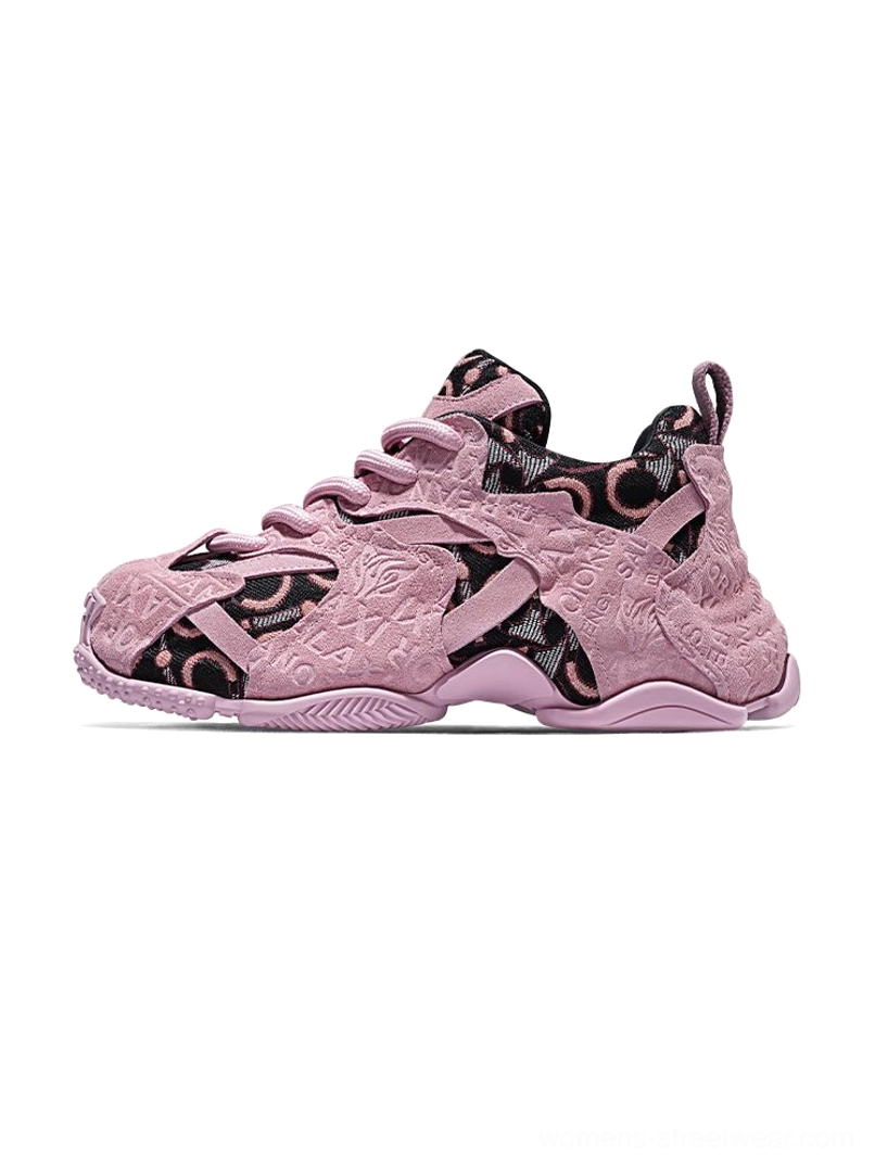 Pink embroidered chunky dad sneakers in a left front side view with suede-textured upper, tonal monogram detailing, lace-up closure and thick layered platform sole