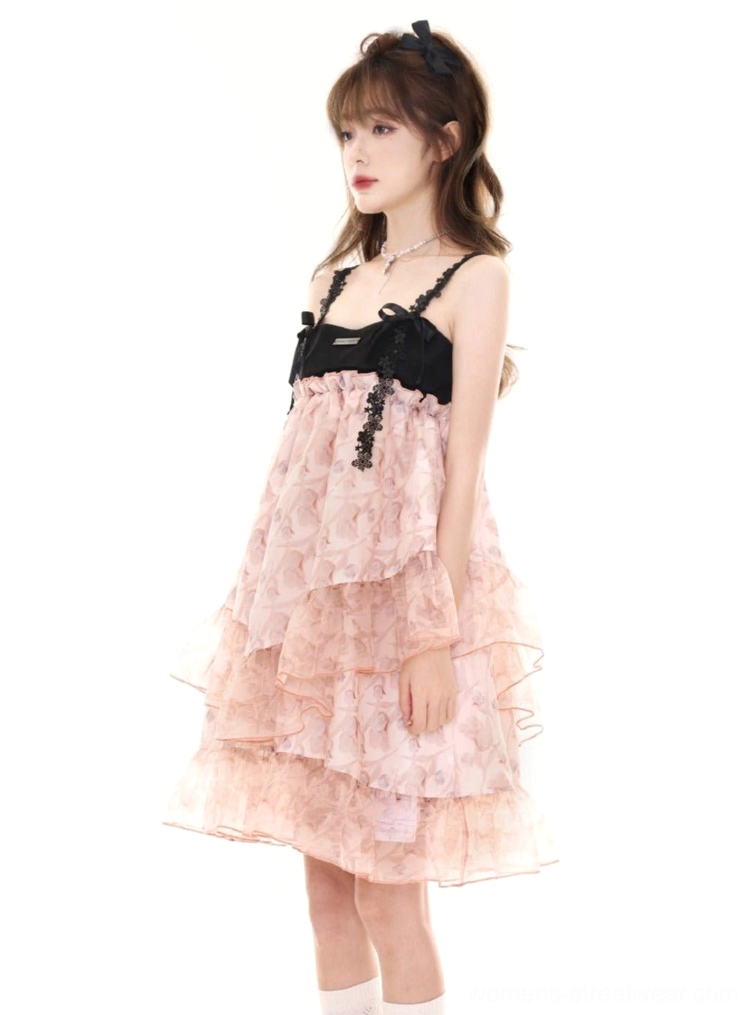 Full body pink floral layered tulle slip dress with black bows silver necklace and white socks