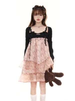 Pink floral tiered tulle slip dress styled with a black cropped cardigan and white socks