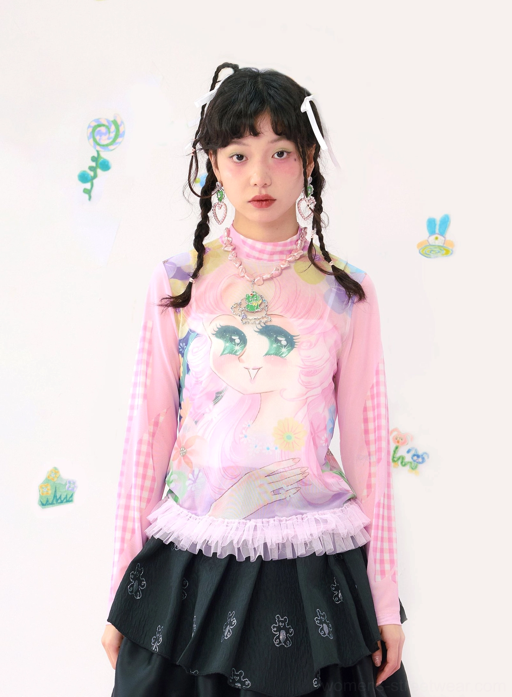 Front close-up of pink gingham cartoon graphic long sleeve top with mock neck and pink tulle ruffle hem