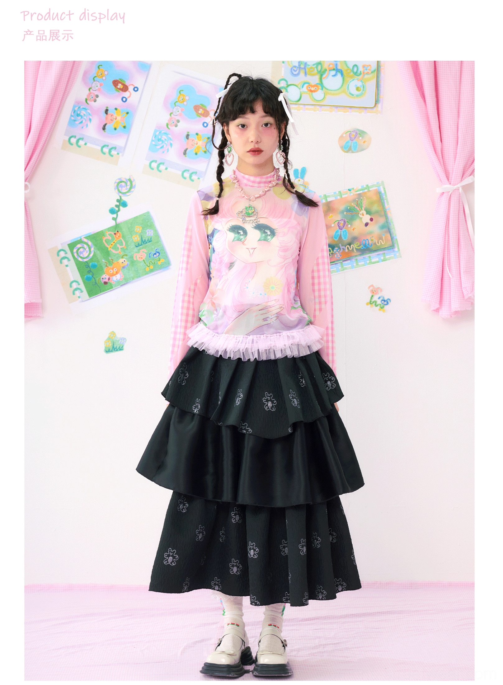 Full body front view of pink gingham cartoon tulle hem streetwear top styled with black tiered midi skirt