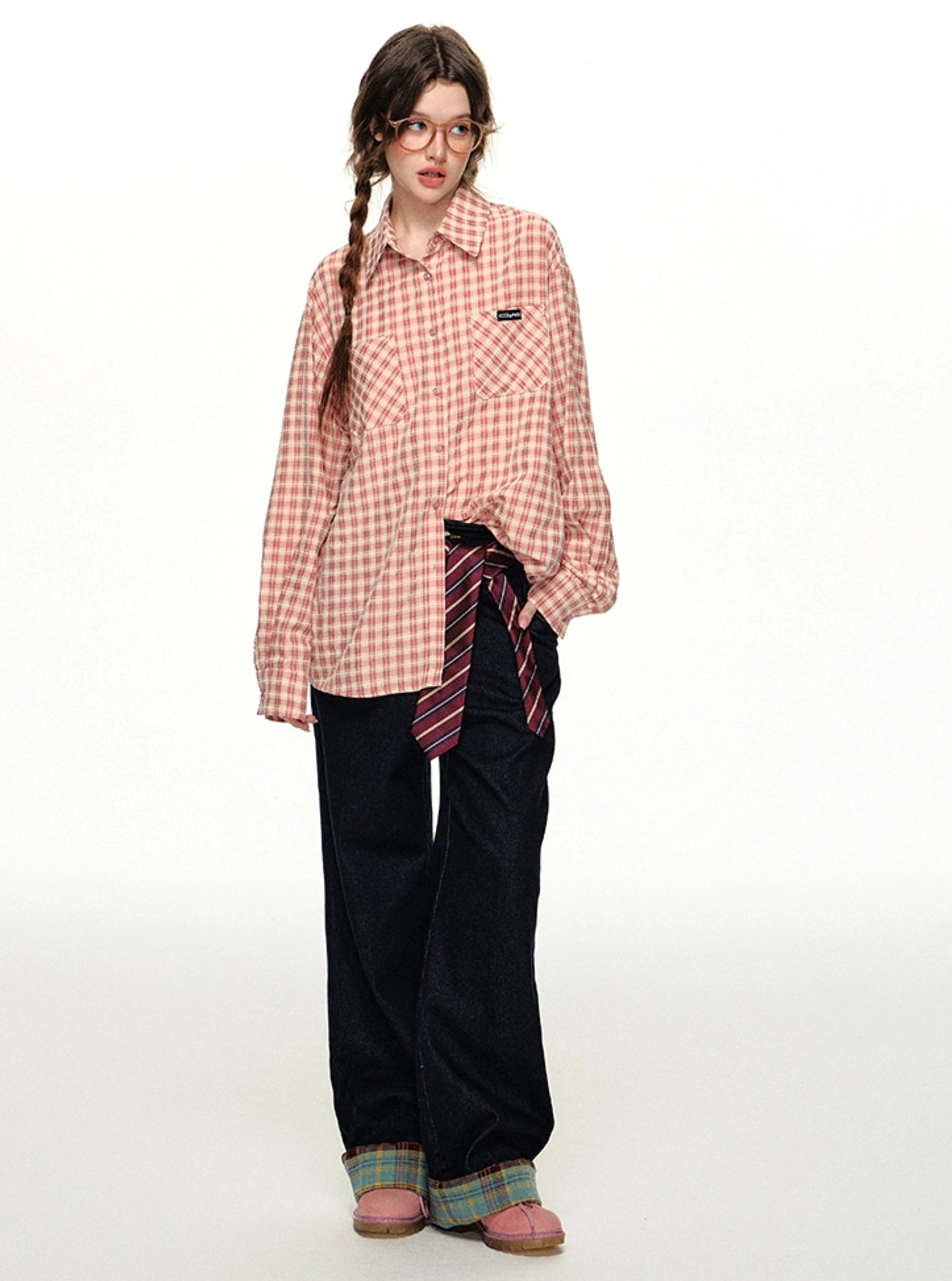 Pink gingham oversized button-up shirt product image showing the retro plaid pattern, relaxed fit, and classic collar