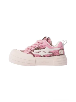 Pink glitter platform sneaker left side profile with woven textile upper white star patch thick light pink rubber sole and heel pull tab