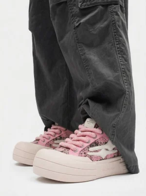 Pink glitter platform sneakers styled with dark gray cuffed cargo pants in a casual Seoul-inspired streetwear outfit