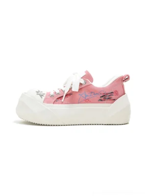 Pink graffiti print canvas platform sneakers with star toe detail and chunky white rubber sole