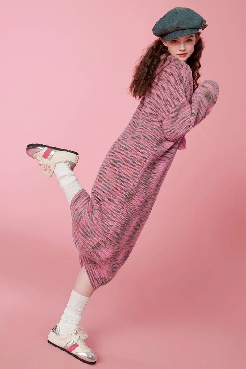 Dynamic side view of a pink hooded space-dyed knit midi dress styled with sneakers and socks for casual Korean streetwear