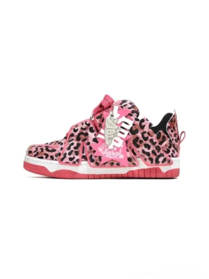 Pink leopard print low-top skate sneakers shown in a left side profile with hot pink sole and lacing accents