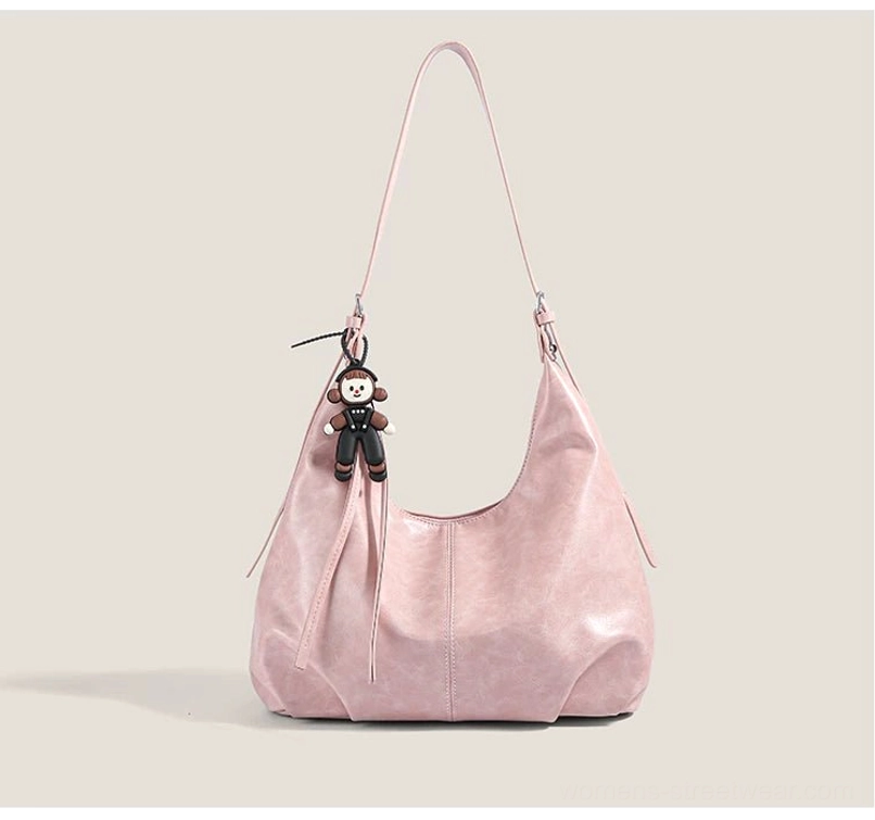 Pink with pendant monkey charm hobo shoulder bag with soft faux-leather crescent shape for playful Y2K streetwear outfits