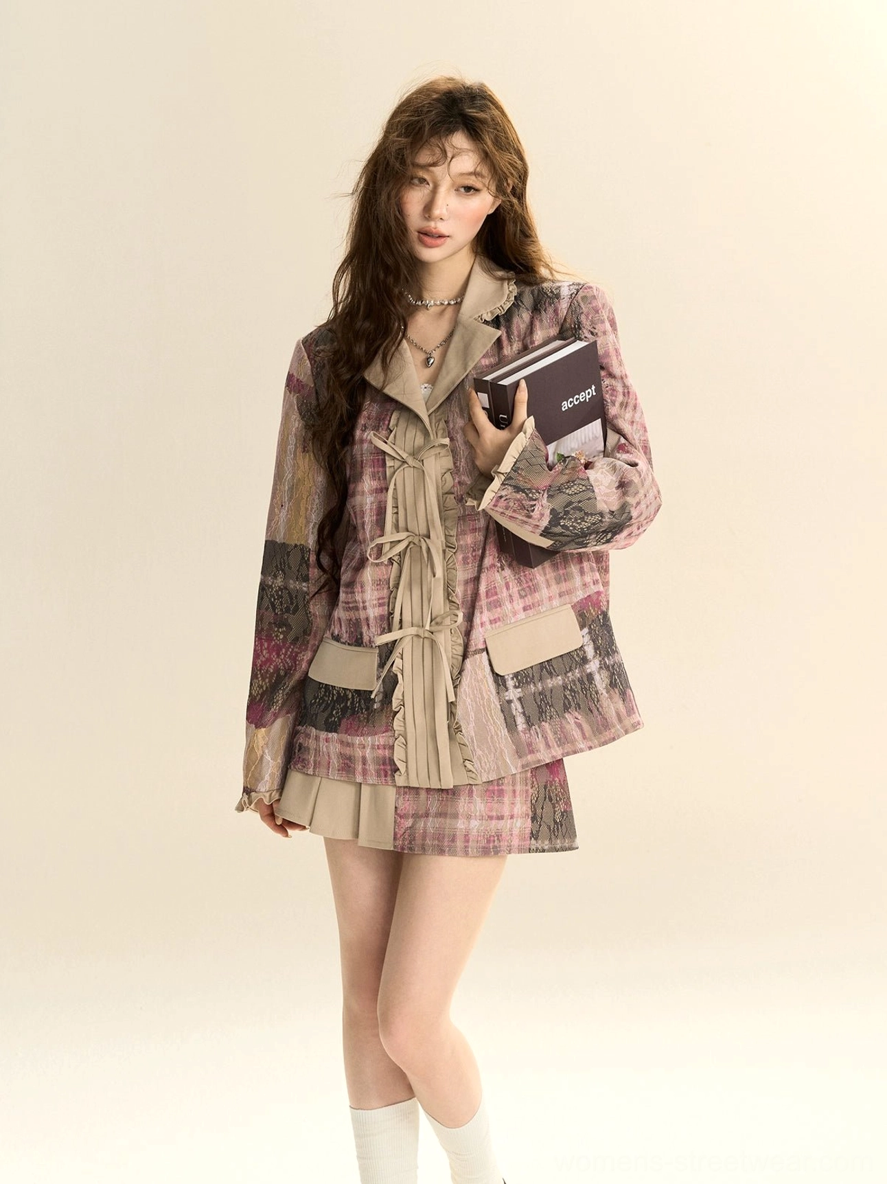 Side profile outfit view featuring a pink plaid oversized blazer and pleated mini skirt styled with white crew socks and brown loafers