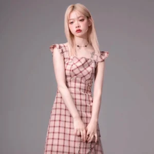 Front view of a blush pink plaid midi dress with sweetheart neckline fitted waist and ruffled hem