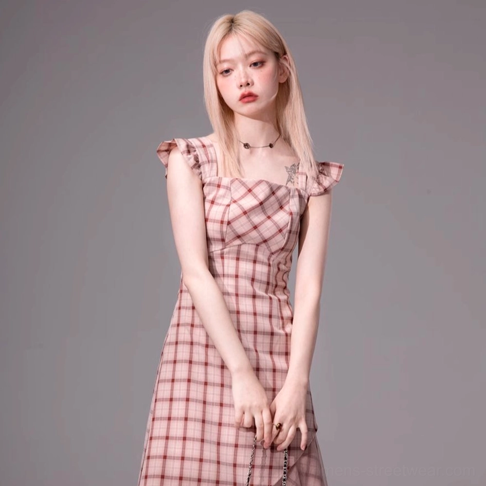 Front view of a blush pink plaid midi dress with sweetheart neckline fitted waist and ruffled hem