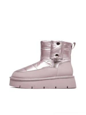 Pink quilted platform snow boots side profile showing quilted padded upper metallic finish chunky segmented sole and heel pull tab detail streetwear footwear