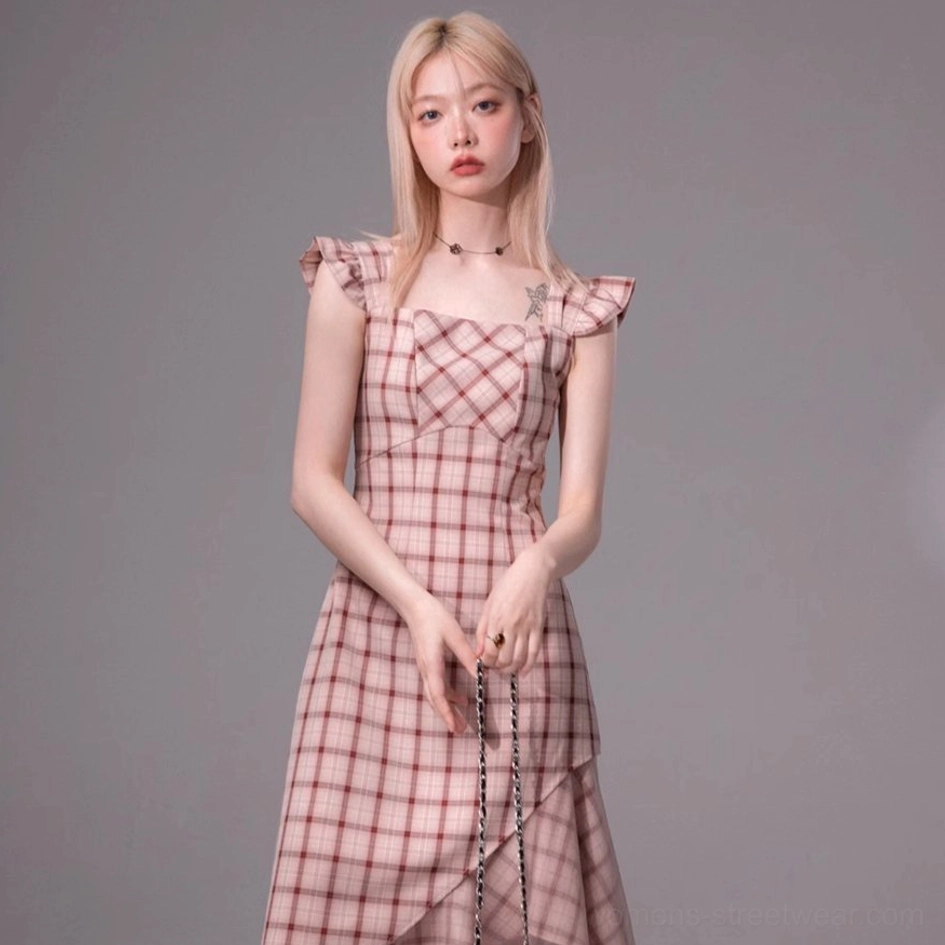 Front upper-body view of a pink and red plaid midi dress with fitted bust and flutter cap sleeves