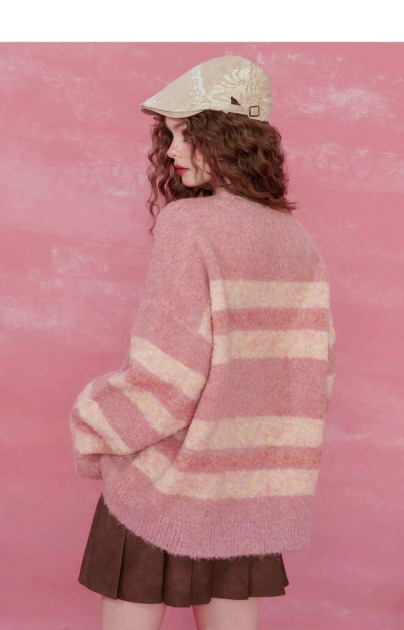 Back view of pink striped fuzzy knit sweater with relaxed silhouette and horizontal pastel stripes