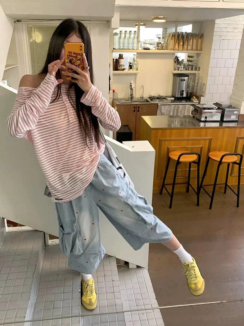 Women’s pink striped off-shoulder henley tee styled with cropped denim cargo pants in mirror selfie
