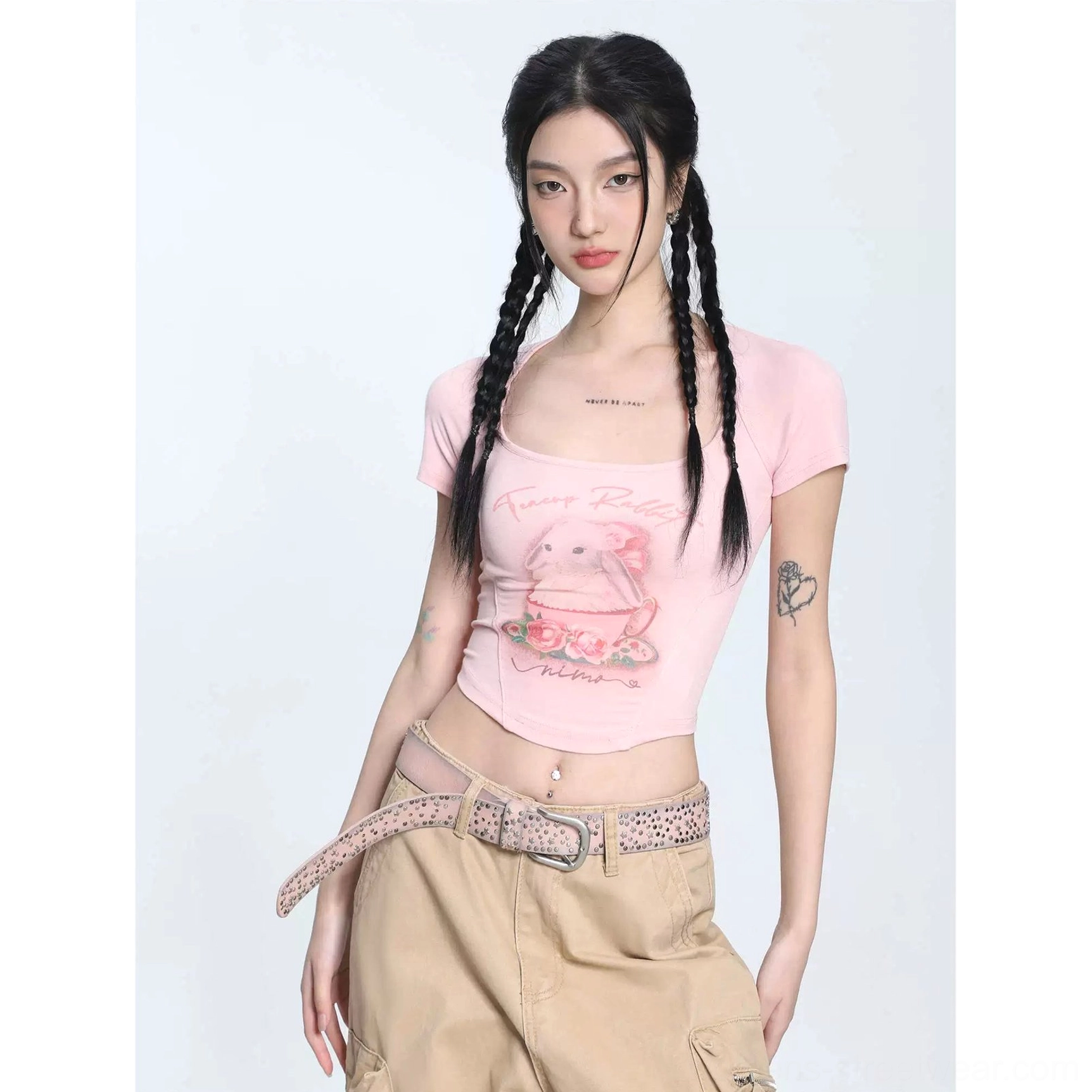 Pastel pink teacup bunny print cropped short sleeve T-shirt styled with khaki cargo pants and leopard print waist belt